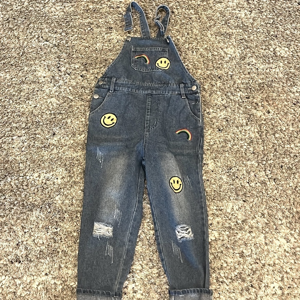 Cute smiley face and rainbow patched romper